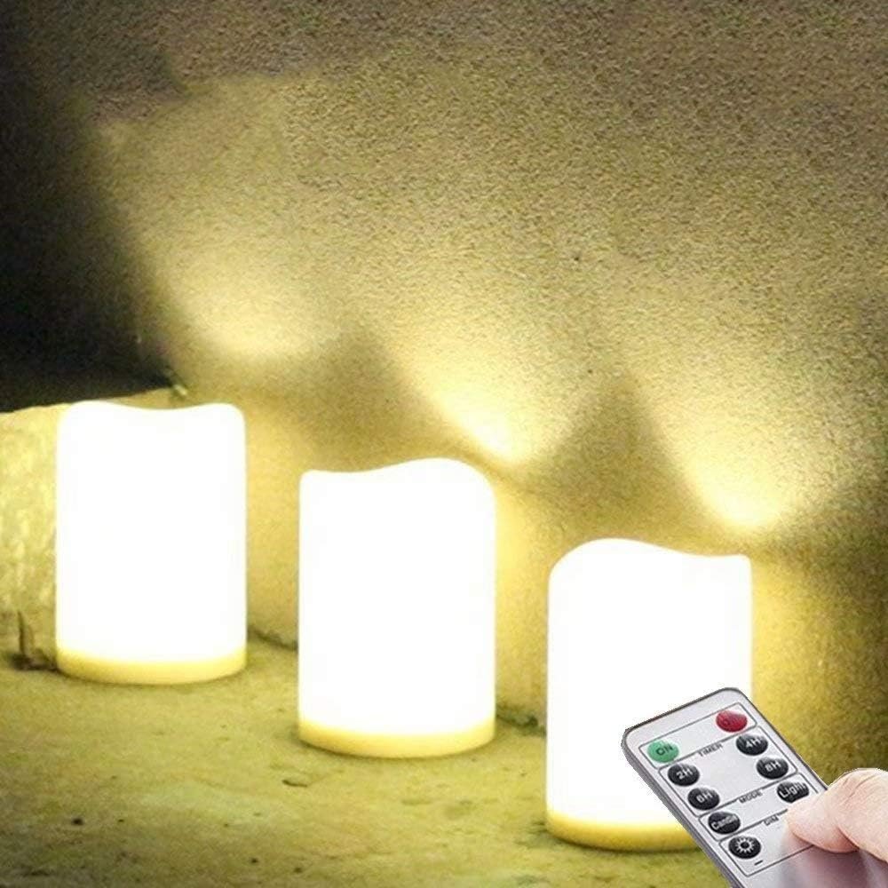 Set of 3 Outdoor IP44 Warm White LED Rainproof Waterproof Flameless Battery LED Pillar Candles with Remote and Timer, Plastic, Won’t Melt, Weather Resistant Design 3 x 4″, Timer 24hours